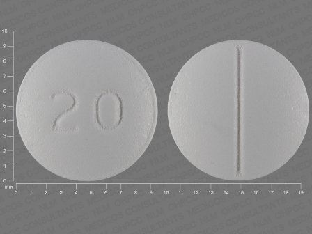 20 round scored white tablet